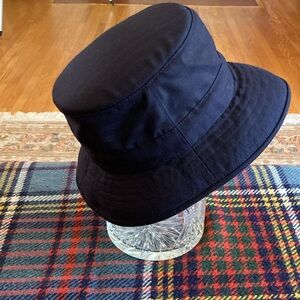 Tilley Endurables Winter Hat with ear flaps.Size 7 (22”, 56.5 cm).Made in Canada